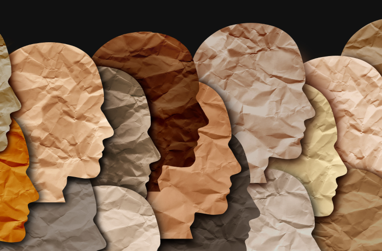 Paper cutouts of various heads in different shades