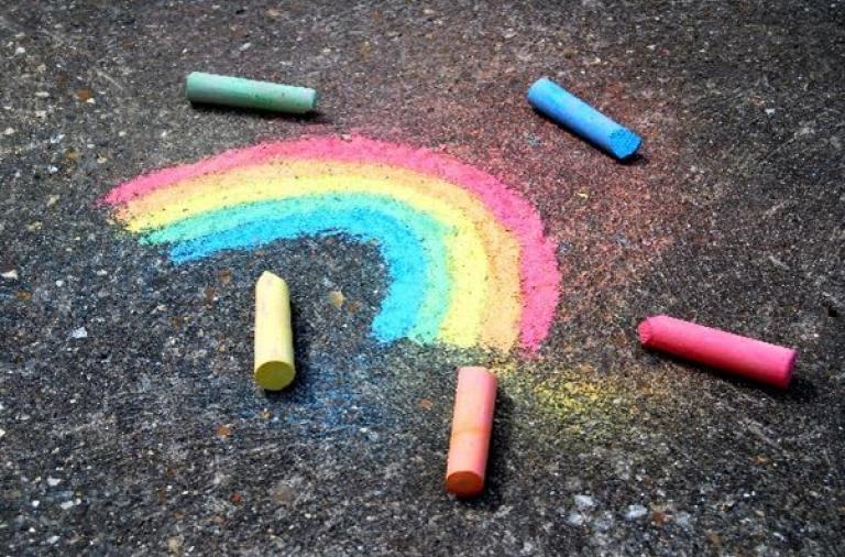 Playground chalk drawing of rainbow