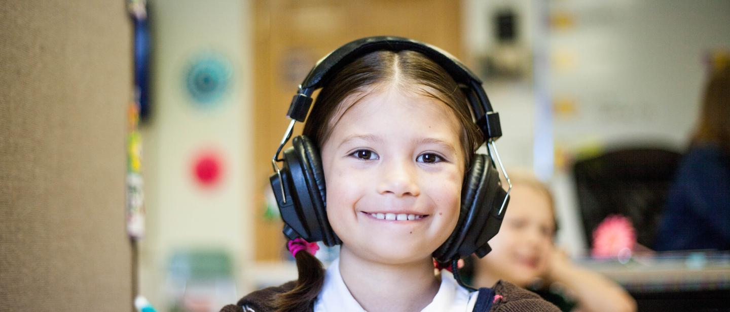 A child with headphones on