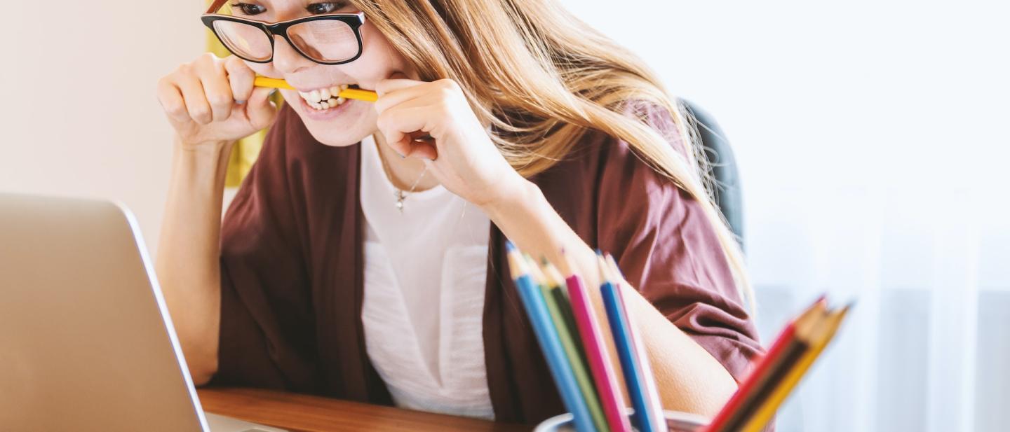 Young woman working on a project on her laptop