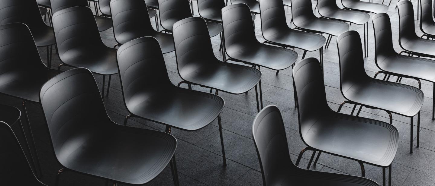 Hall filled with empty school chairs