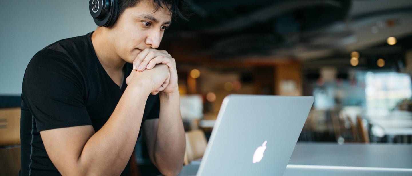 person with headphones on listening to a presentation