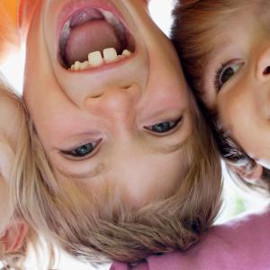 3 kids aged 3 to 5 smiling