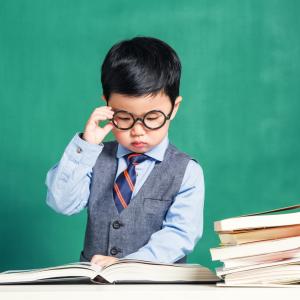 Studious young child with books